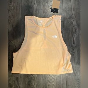 New with tags The North Face womens relaxed fit tank. Color: Apricot Ice